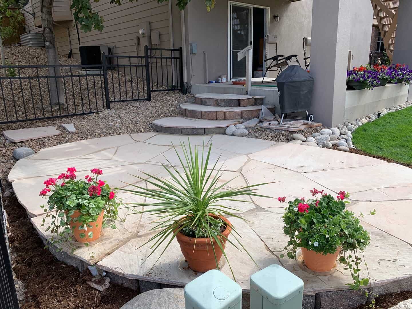 Flowers on a beautiful stone patio done by Minh.